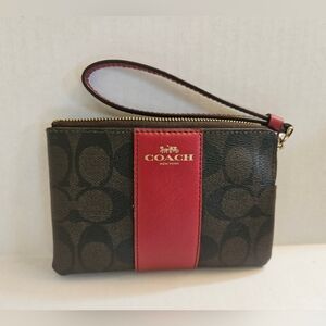 Coach Corner Zip Wristlet In Signature Canvas in Brown and Red.